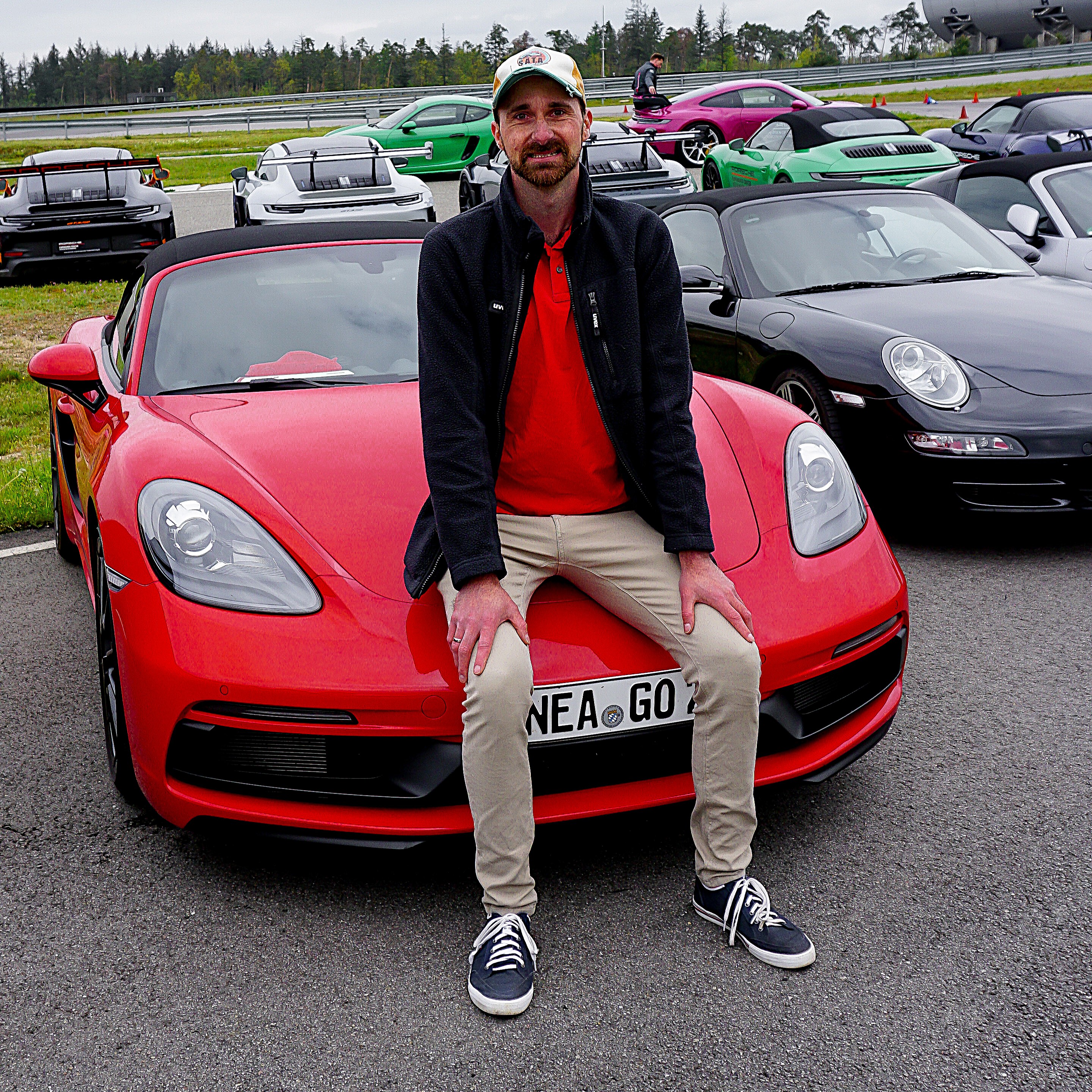 Sebastian Goldberg with a selection of classic and modern Porsche cars